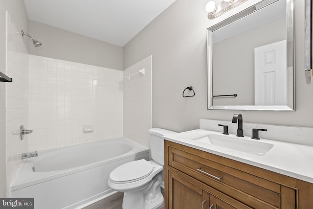full bath with vanity, toilet, wood finished floors, and tub / shower combination