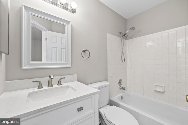 full bathroom featuring vanity, washtub / shower combination, and toilet