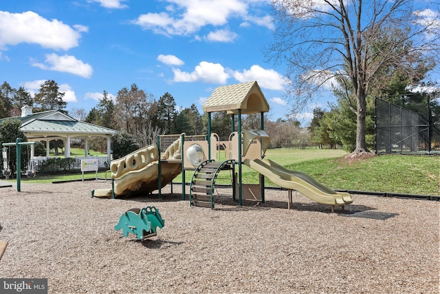 community playground featuring a gazebo and fence