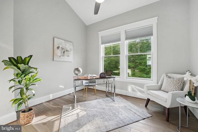 home office with baseboards, a ceiling fan, vaulted ceiling, and wood finished floors