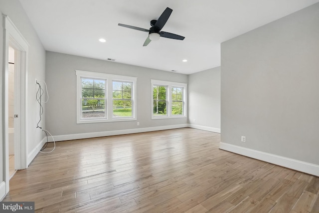 interior space with recessed lighting, baseboards, visible vents, and light wood finished floors