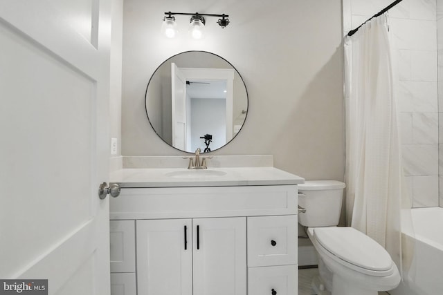full bathroom with toilet, shower / bath combo with shower curtain, and vanity