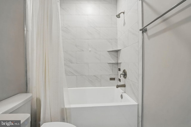 bathroom featuring toilet and shower / tub combo