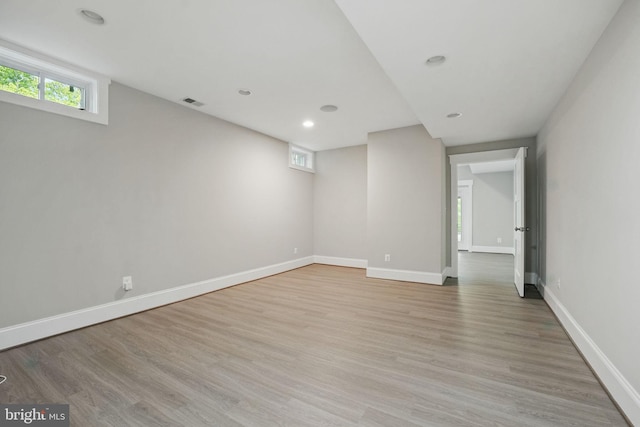 interior space with baseboards, recessed lighting, light wood finished floors, and visible vents