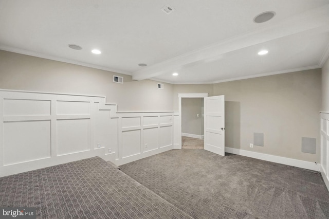interior space featuring visible vents, ornamental molding, a decorative wall, recessed lighting, and carpet