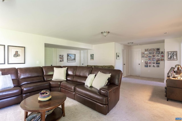 living area featuring light carpet and visible vents