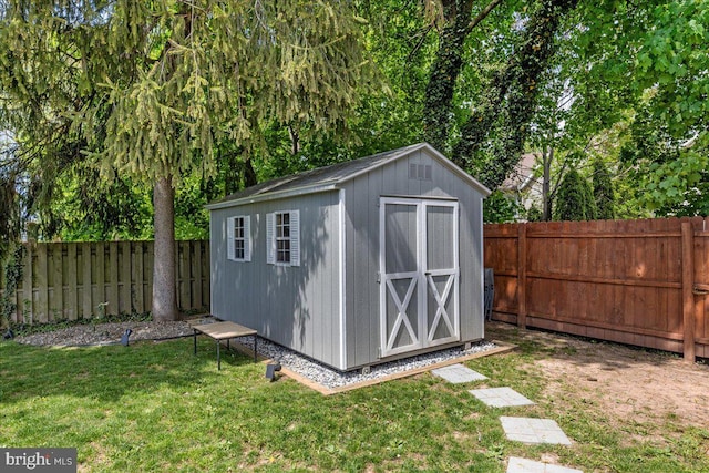 view of shed featuring a fenced backyard
