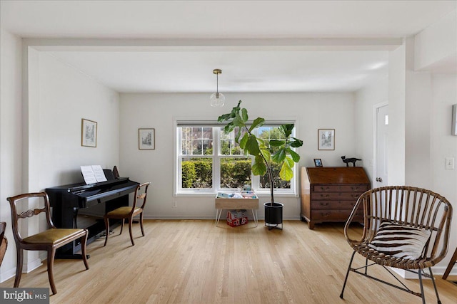 sitting room featuring light wood-style floors and baseboards