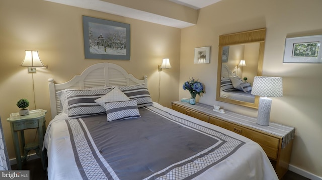 bedroom featuring baseboards
