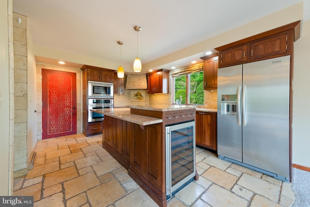 kitchen featuring stone tile flooring, wine cooler, a kitchen island, tasteful backsplash, and stainless steel appliances