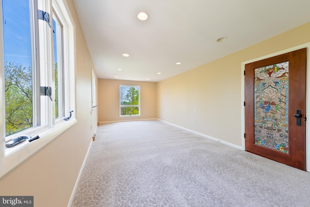 carpeted empty room with recessed lighting and baseboards