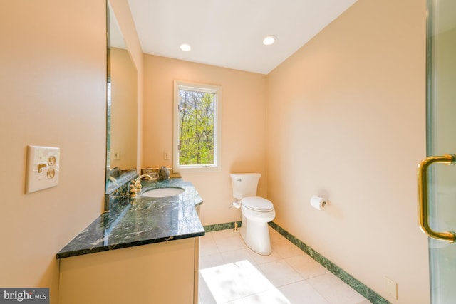 bathroom featuring tile patterned flooring, vanity, toilet, recessed lighting, and baseboards