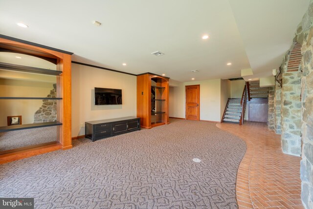 unfurnished living room with recessed lighting, baseboards, and stairway