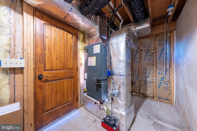 utility room featuring heating unit