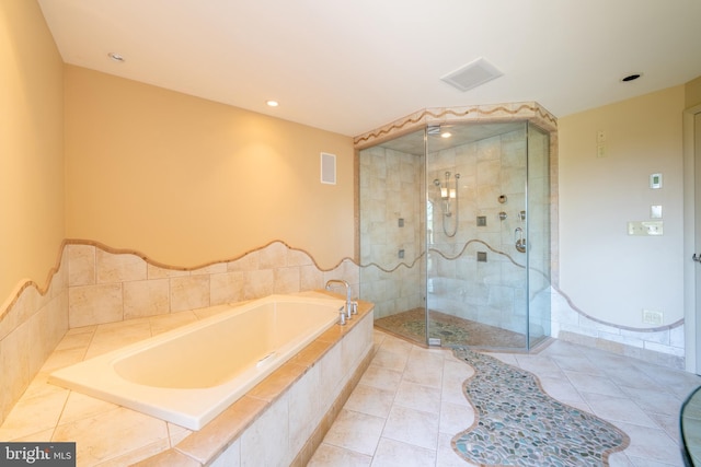 bathroom with tile patterned flooring, recessed lighting, visible vents, a bath, and a stall shower