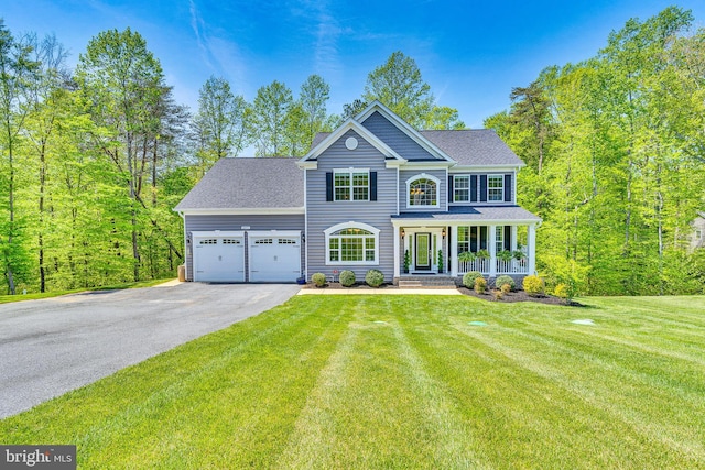 colonial house with a shingled roof, a garage, a front yard, covered porch, and driveway