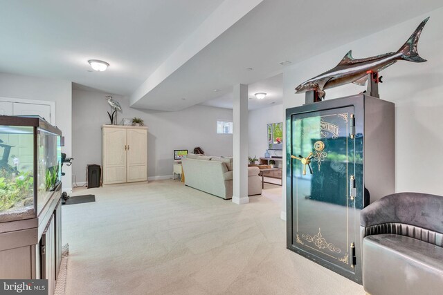 interior space featuring light colored carpet and baseboards