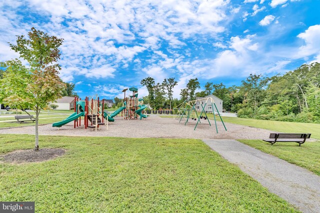 community play area featuring a lawn