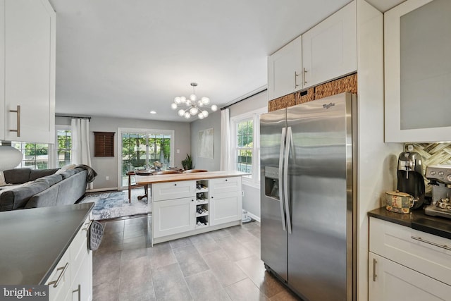13003 Standish Ct, Woodbridge, VA 22192 - kitchen featuring stainless steel fridge with ice dispenser, white cabinetry, baseboards, and recessed lighting