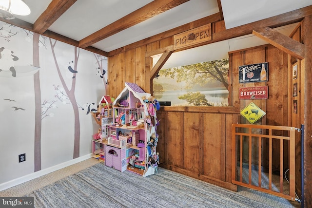 13003 Standish Ct, Woodbridge, VA 22192 - rec room featuring beamed ceiling, wooden walls, carpet floors, and baseboards