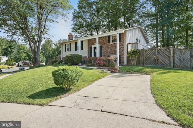 13003 Standish Ct, Woodbridge, VA 22192 - bi-level home with a chimney and brick siding