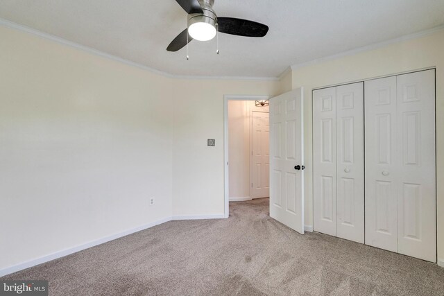 13830 Lord Fairfax Pl, Upper Marlboro, MD 20772 - unfurnished bedroom featuring carpet, crown molding, baseboards, a closet, and a ceiling fan
