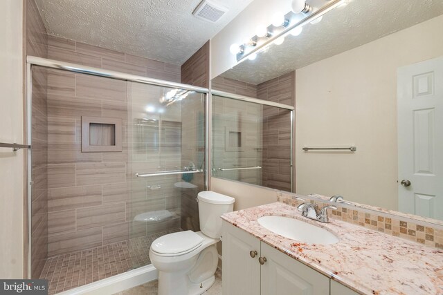 13830 Lord Fairfax Pl, Upper Marlboro, MD 20772 - bathroom with a shower stall, toilet, a textured ceiling, and vanity
