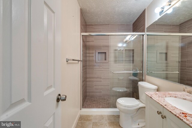 13830 Lord Fairfax Pl, Upper Marlboro, MD 20772 - full bath with a shower stall, toilet, vanity, baseboards, and a textured ceiling