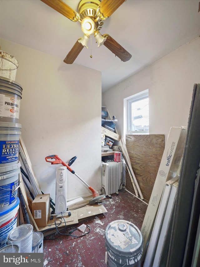 misc room featuring ceiling fan and radiator heating unit