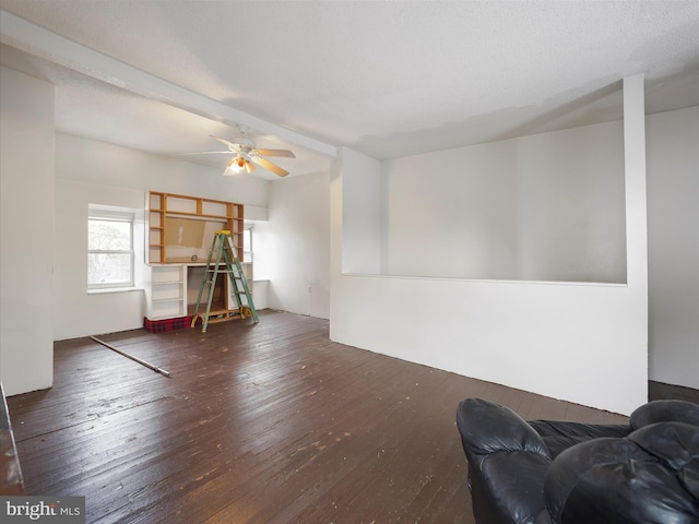 living room with ceiling fan and hardwood / wood-style floors