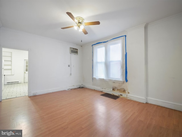 empty room featuring crown molding, ceiling fan, and wood finished floors
