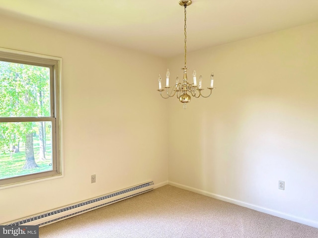 empty room featuring light colored carpet, a baseboard heating unit, a healthy amount of sunlight, and an inviting chandelier