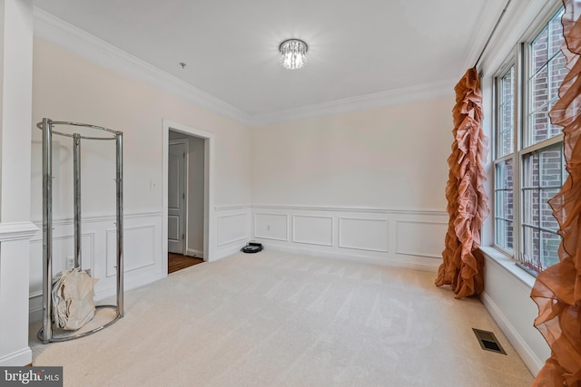 12405 Hillantrae Dr, Clinton, MD 20735 - carpeted empty room with plenty of natural light, crown molding, wainscoting, and a decorative wall