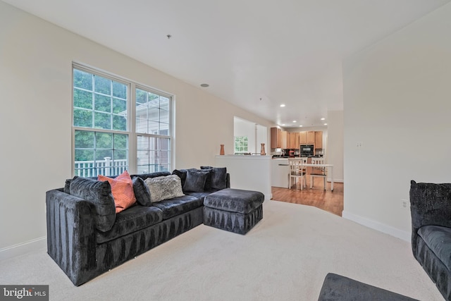 12405 Hillantrae Dr, Clinton, MD 20735 - living area featuring light colored carpet, recessed lighting, and baseboards