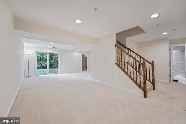 12405 Hillantrae Dr, Clinton, MD 20735 - unfurnished living room with light colored carpet, recessed lighting, stairs, and baseboards