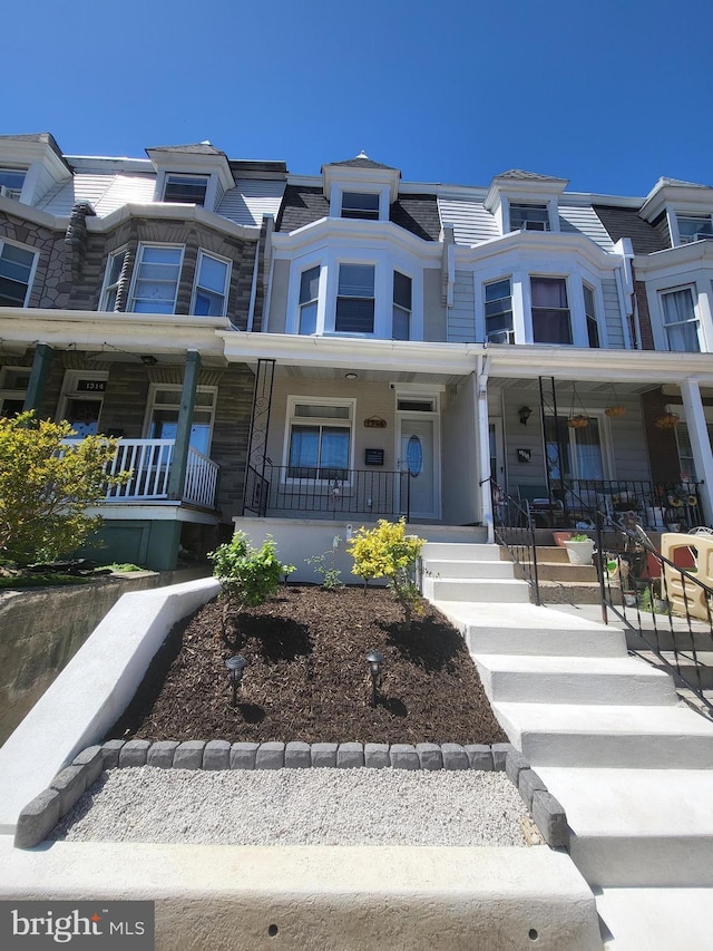 multi unit property featuring a porch