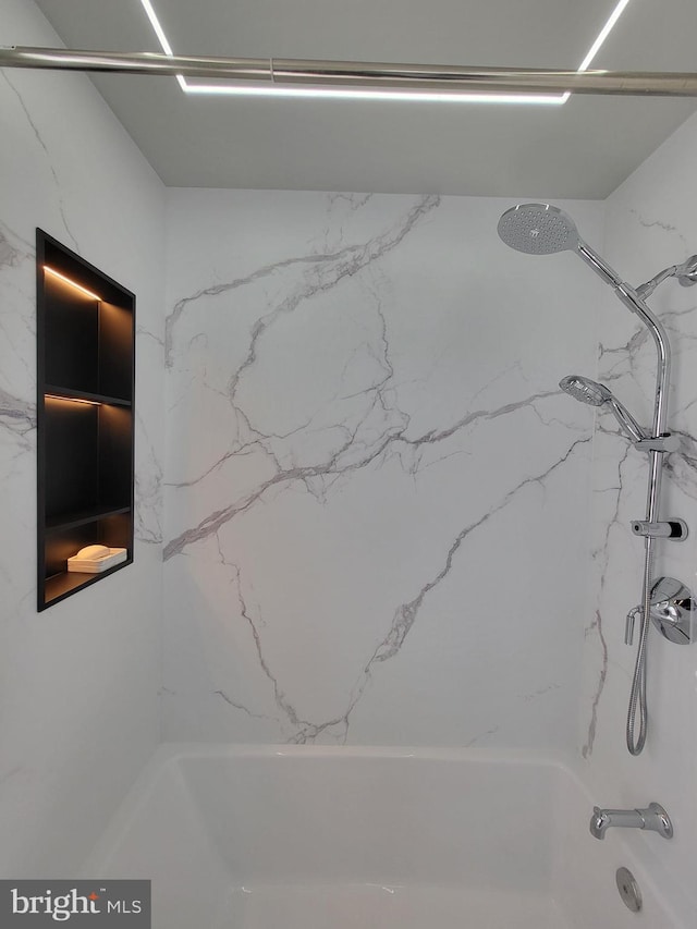 details featuring shower / bathtub combination