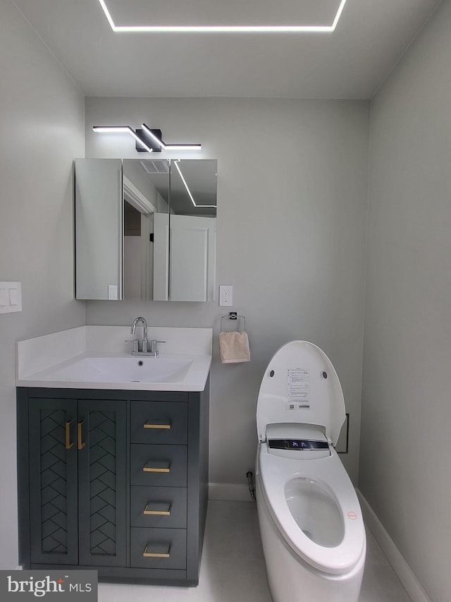 bathroom featuring baseboards and vanity
