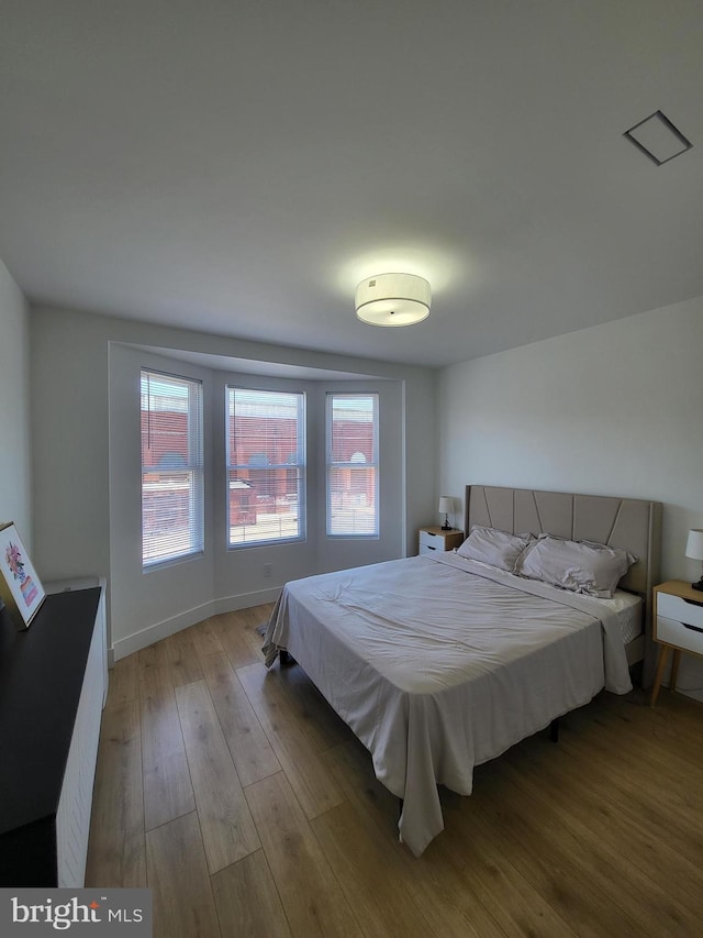 bedroom with wood finished floors