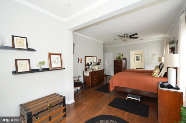 bedroom with crown molding, baseboards, a ceiling fan, and dark wood finished floors