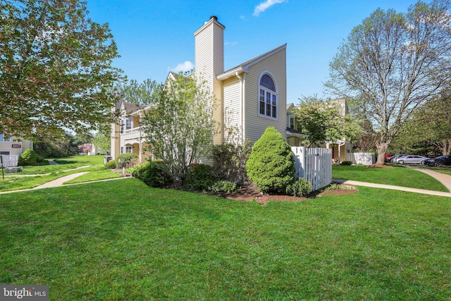 230 Mill Run Ct, Hightstown, NJ 08520 - view of property exterior with a lawn, fence, and a chimney