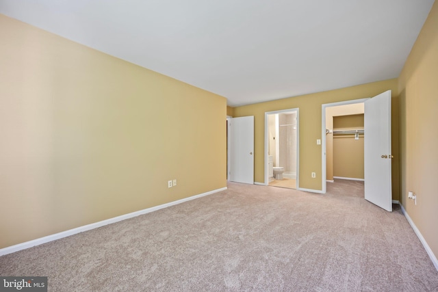 230 Mill Run Ct, Hightstown, NJ 08520 - unfurnished bedroom featuring carpet floors, baseboards, a walk in closet, and connected bathroom
