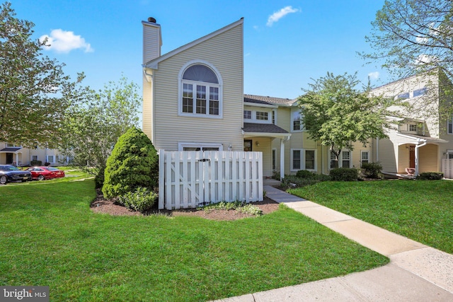 230 Mill Run Ct, Hightstown, NJ 08520 - view of front of home featuring a front lawn, fence, and a chimney