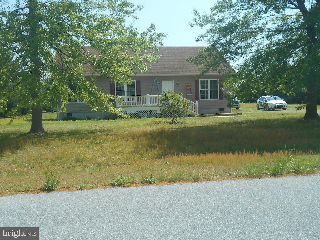 view of front of house with covered porch, crawl space, and roof with shingles