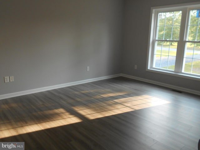 6271 Solomons Cir, Hurlock, MD 21643 - unfurnished room with healthy amount of natural light, baseboards, and dark wood finished floors