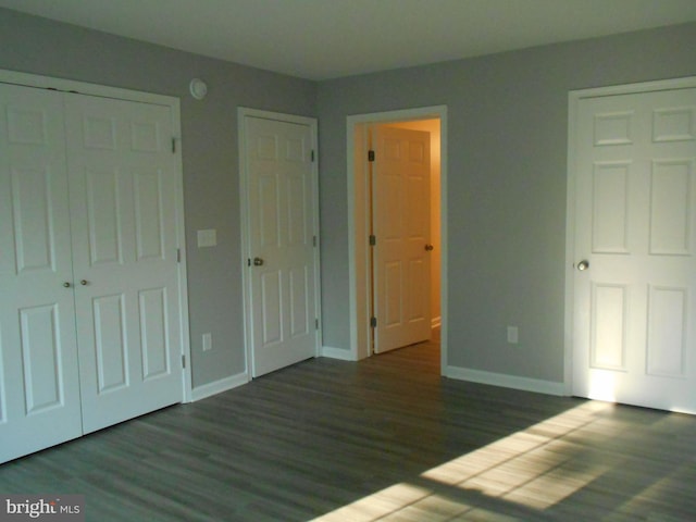 6271 Solomons Cir, Hurlock, MD 21643 - unfurnished bedroom featuring baseboards, wood finished floors, and a closet