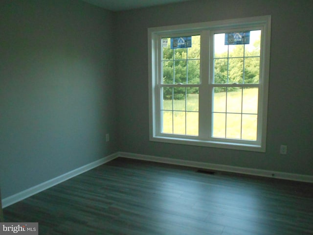6271 Solomons Cir, Hurlock, MD 21643 - empty room featuring baseboards and dark wood-style flooring