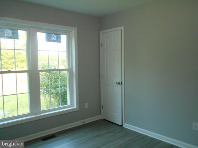 6271 Solomons Cir, Hurlock, MD 21643 - empty room featuring baseboards and dark wood-type flooring