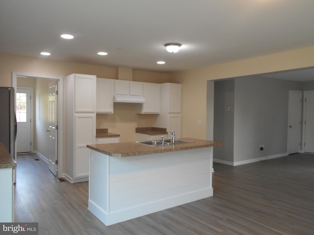 6271 Solomons Cir, Hurlock, MD 21643 - kitchen with freestanding refrigerator, dark wood-type flooring, white cabinetry, a sink, and baseboards