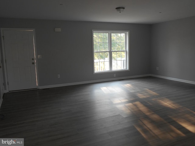 6271 Solomons Cir, Hurlock, MD 21643 - spare room with baseboards and dark wood-style flooring